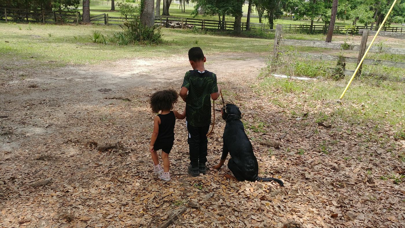 Two Kids with a Dog